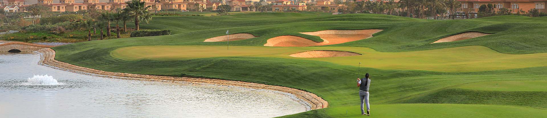 Image of golf ball on tee on grass.